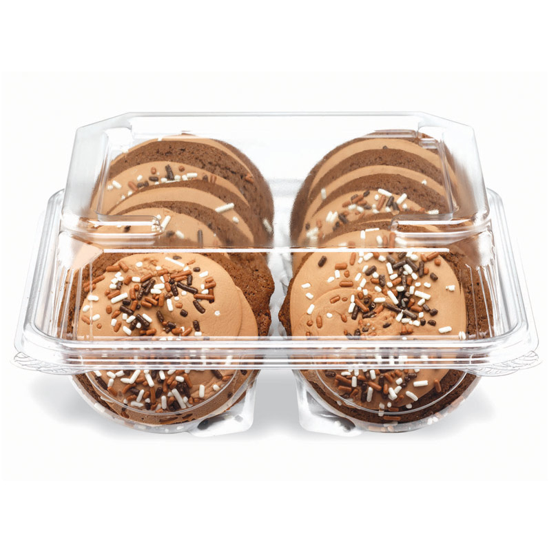 Four chocolate cupcakes topped with caramel frosting and chocolate, white, and orange sprinkles in a clear container