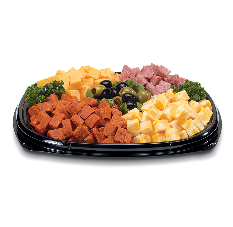 Tray of assorted cubed cheeses and meats with black and green olives and parsley garnish