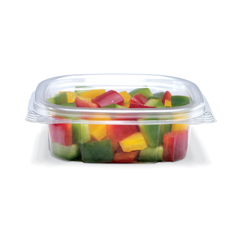 Clear plastic container filled with chopped red, yellow, and green bell peppers