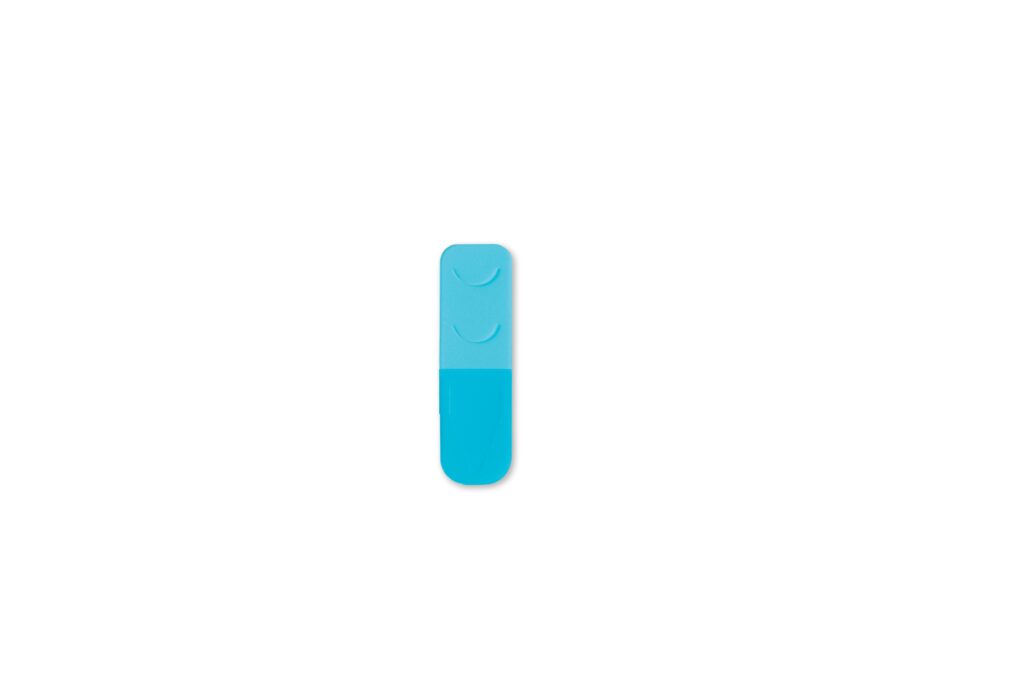 Blue rounded rectangular object with two curved indentations and a darker blue lower section