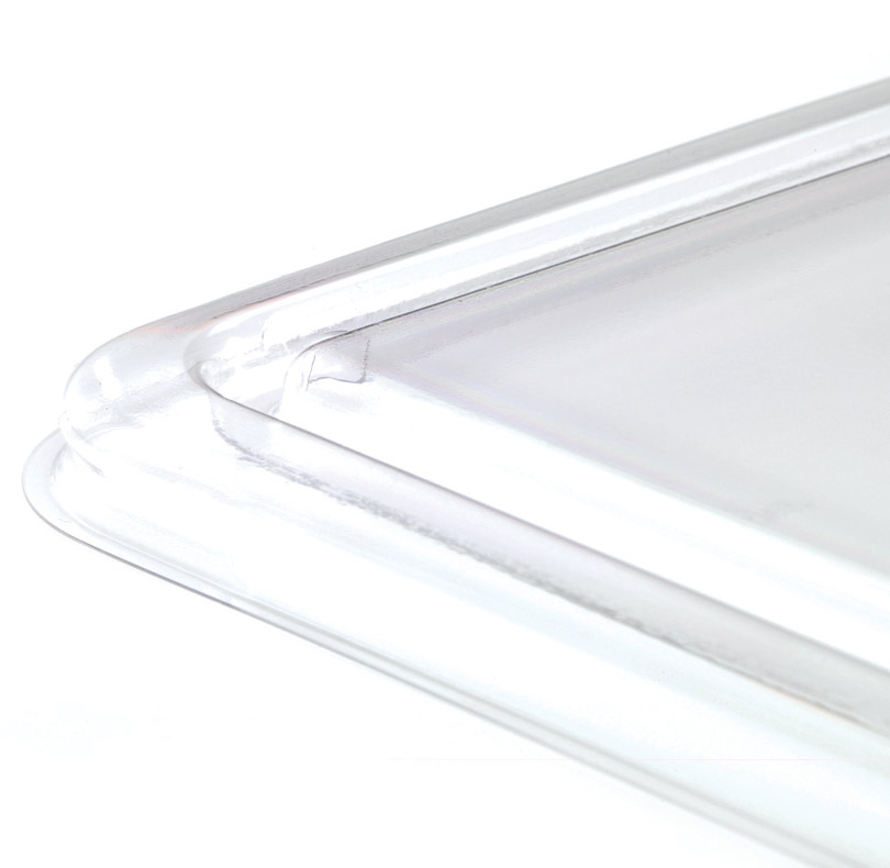 Clear plastic rectangular tray with raised edges