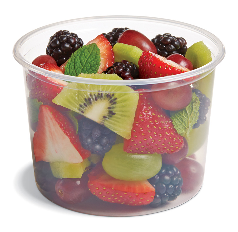 Cup of mixed fruit salad with strawberries, blackberries, grapes, kiwi, melon, and mint