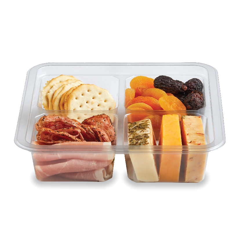 Compartmentalized container with crackers, dried fruit, cured meats, and assorted cheeses