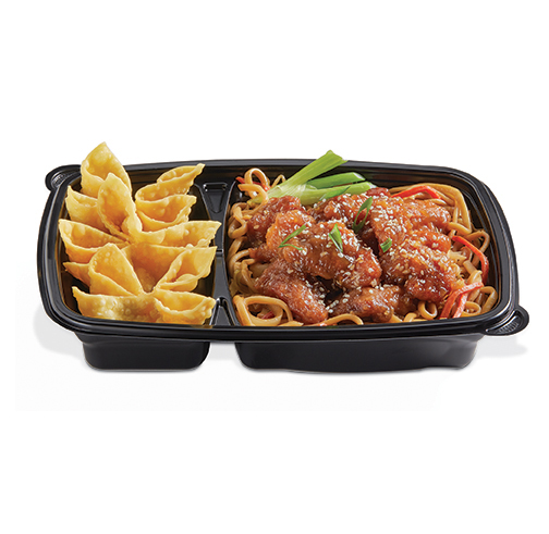 Divided takeout tray with crispy wonton chips and saucy noodles topped with sesame chicken