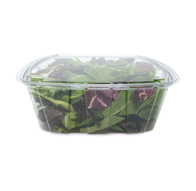 Container of mixed leafy greens with a clear lid