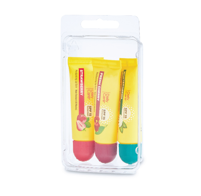 Three Daily Care SPF 15 lip balms in strawberry, fresh cherry, and mint flavors in a blister pack