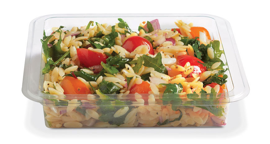 Container of orzo pasta salad with spinach, tomatoes, peppers, and red onion