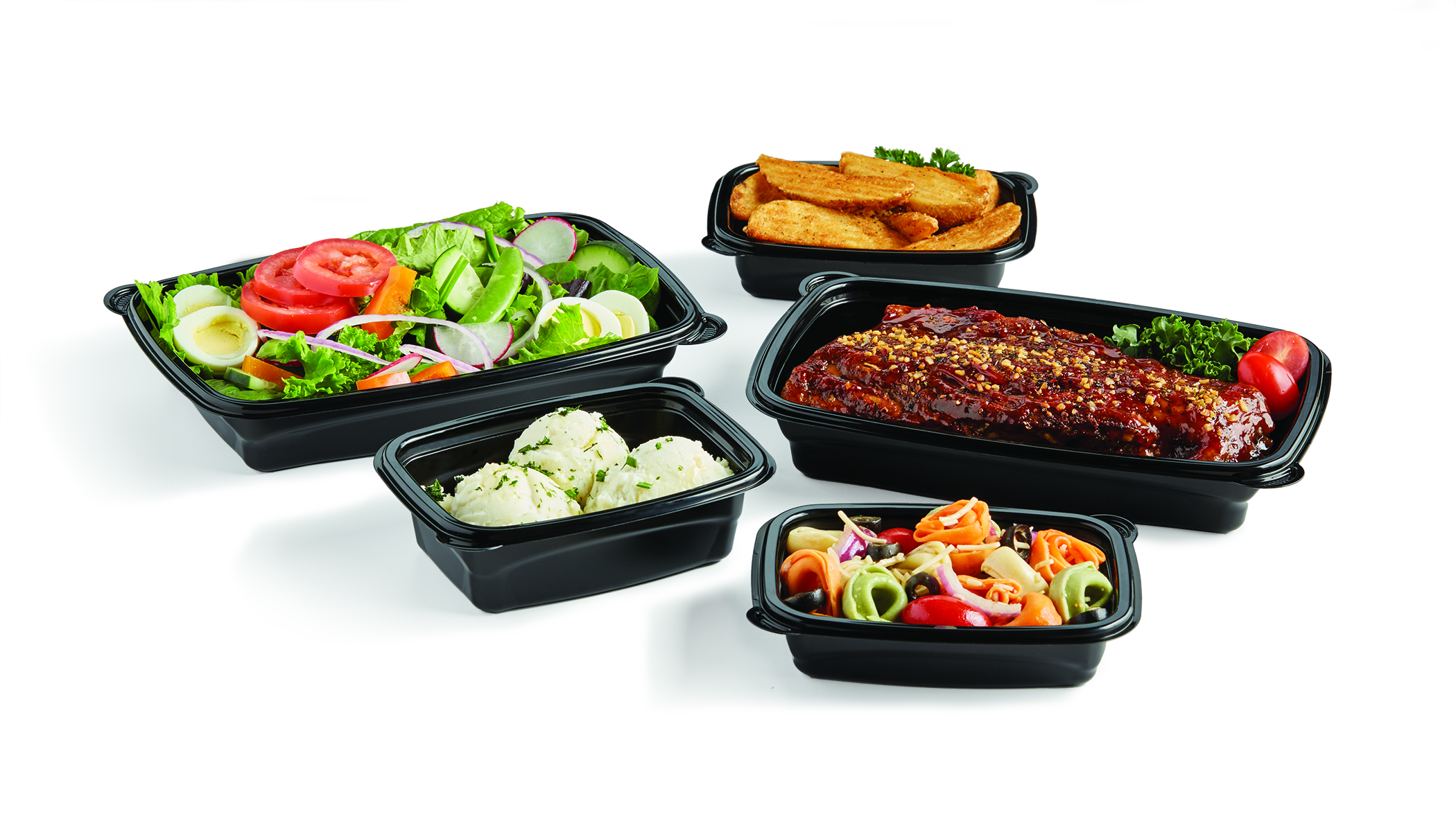 Meal-prep containers filled with salad, glazed ribs, potato wedges, mashed potatoes, and pasta salad
