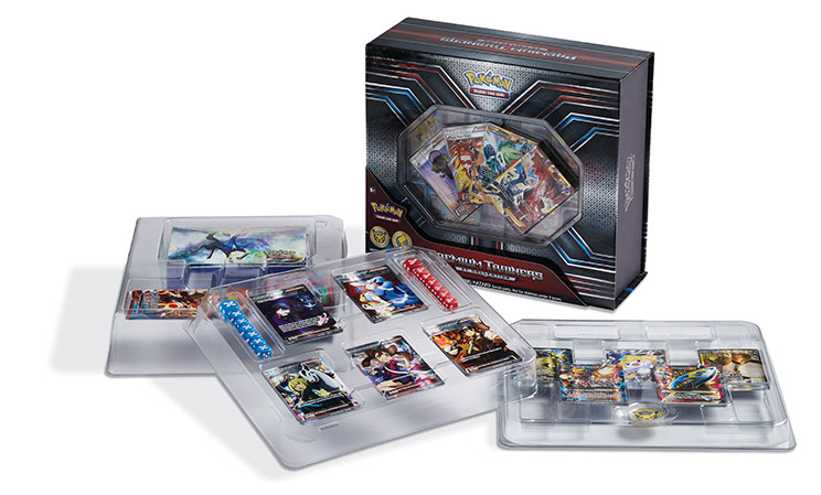 Pokémon Trading Card Game premium collection box with trading cards and game accessories displayed