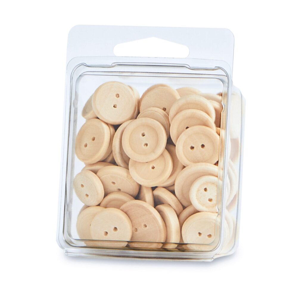 Clear plastic container filled with small, round beige biscuits with small holes