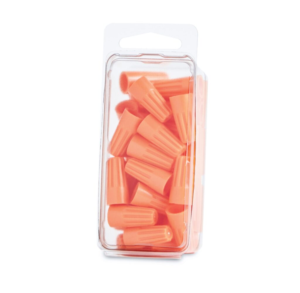 Clear package containing orange plastic forks and knives