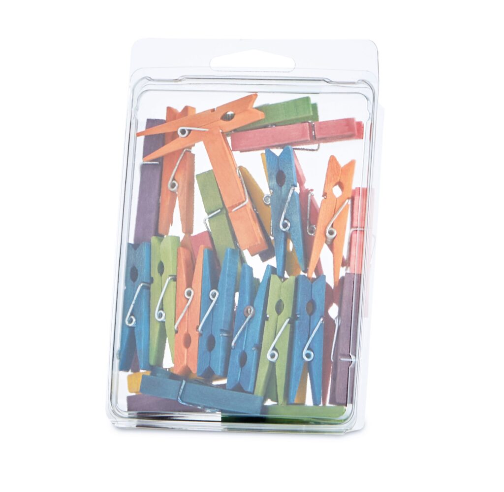 Colorful wooden clothespins in clear plastic packaging