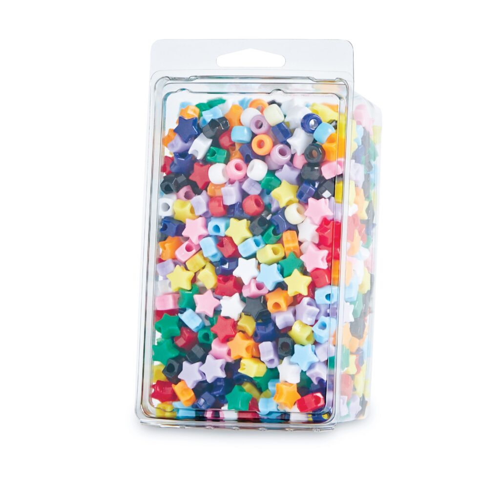 Clear container filled with colorful star- and cube-shaped plastic beads