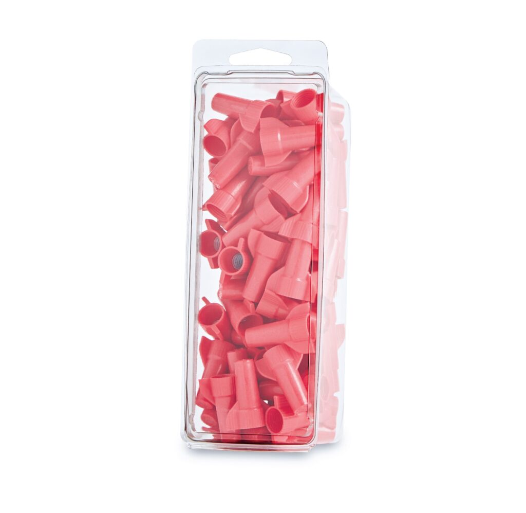 Package of pink plastic tube connectors in a clear blister pack