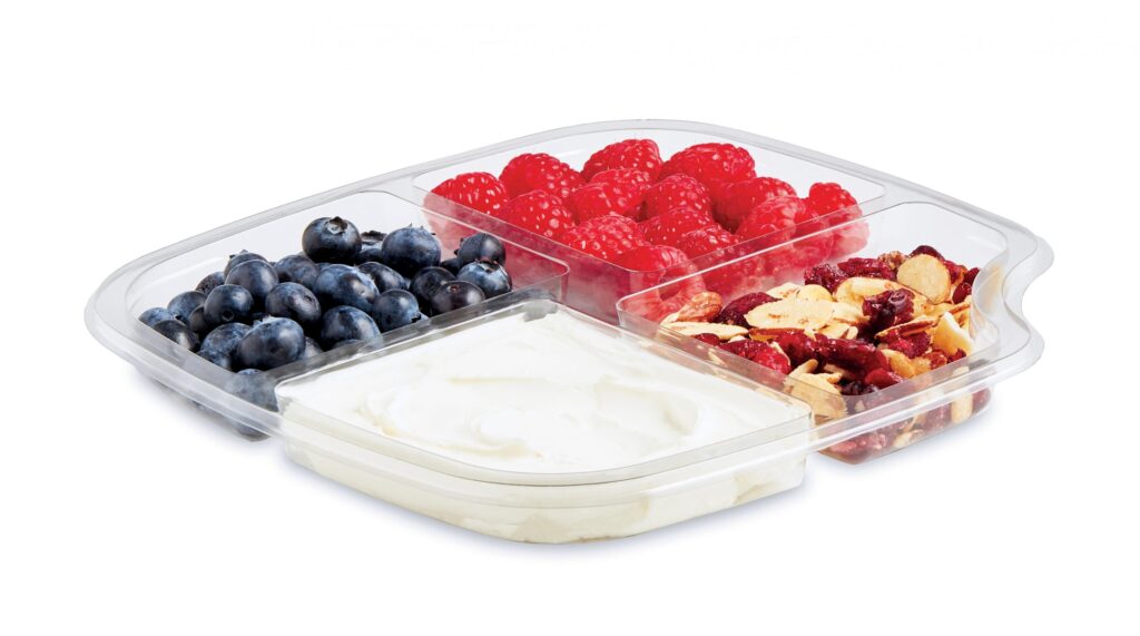 Tray of yogurt with blueberries, raspberries, and granola