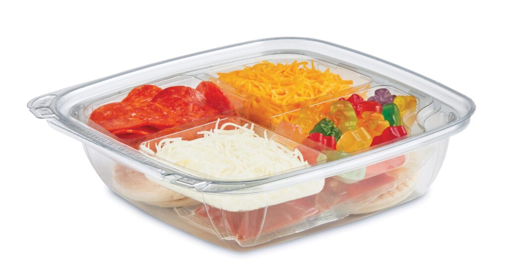 Clear glass divided baking dish filled with pepperoni, shredded cheese, bell peppers, tomato sauce, and pizza dough