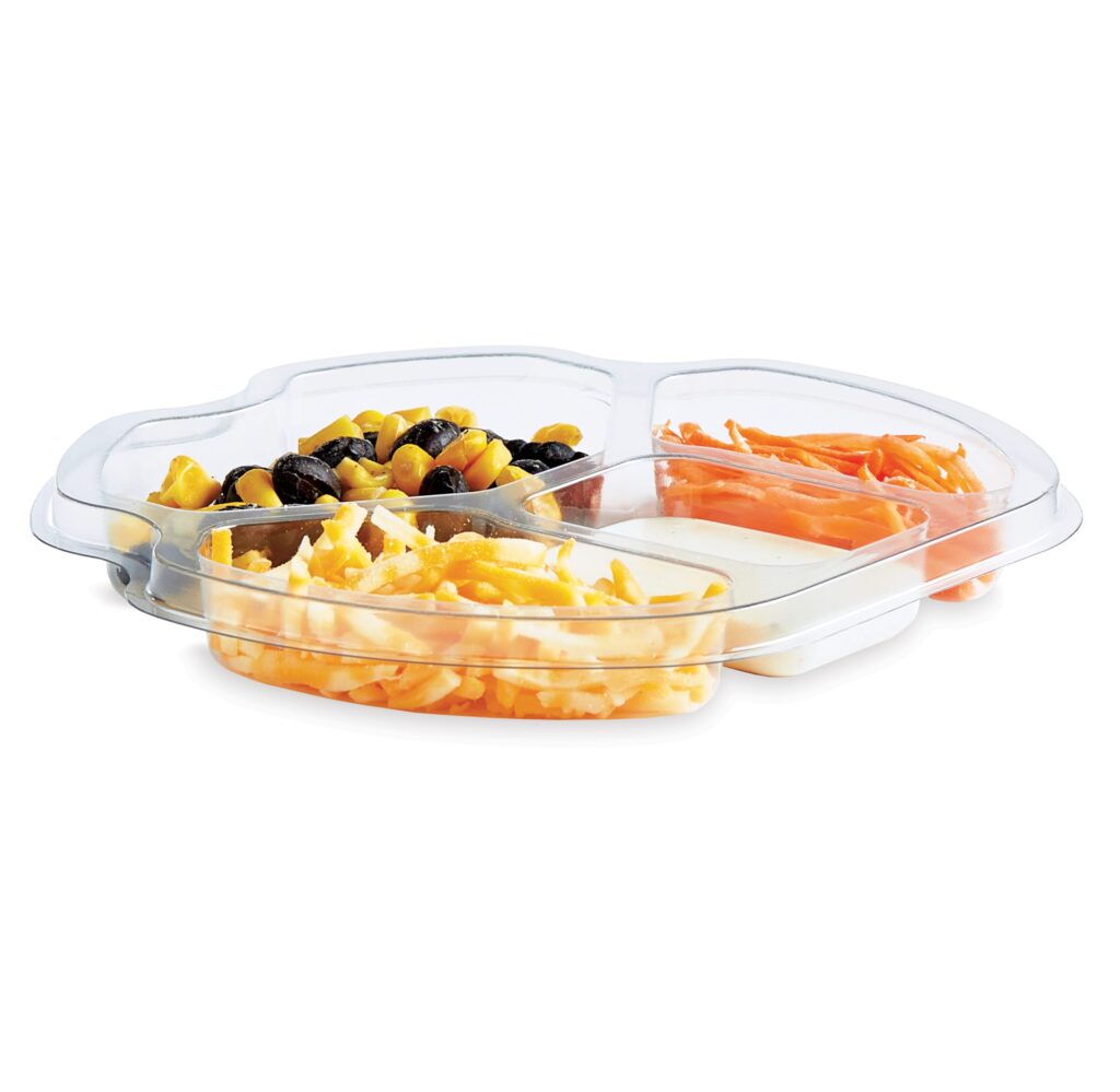 Clear divided serving tray holding olives and corn, carrot sticks, shredded cheese, and dip