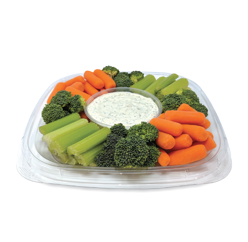 Tray of baby carrots, celery sticks, and broccoli with a bowl of dip