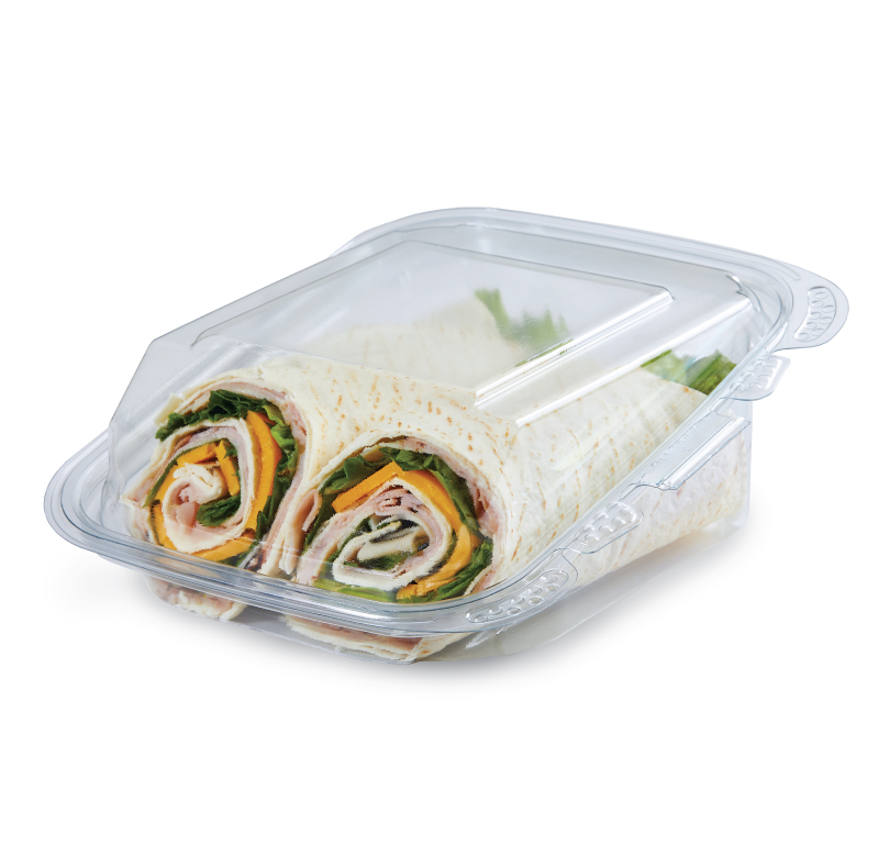 Two sliced tortilla wraps with deli meat, cheese, and lettuce in a clear plastic container