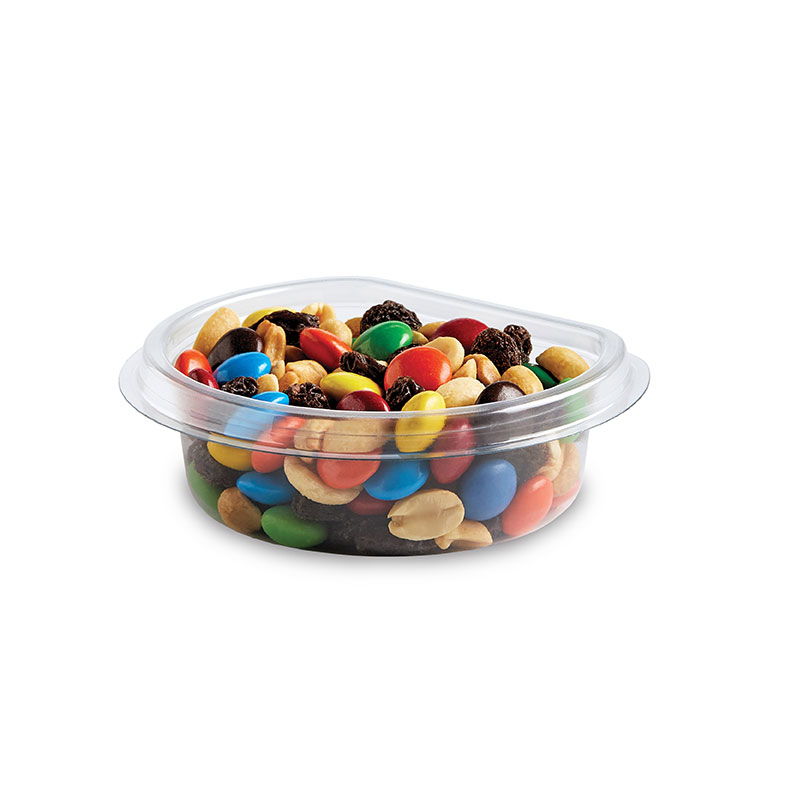 Clear container filled with trail mix, including peanuts, raisins, and colorful candy-coated chocolates