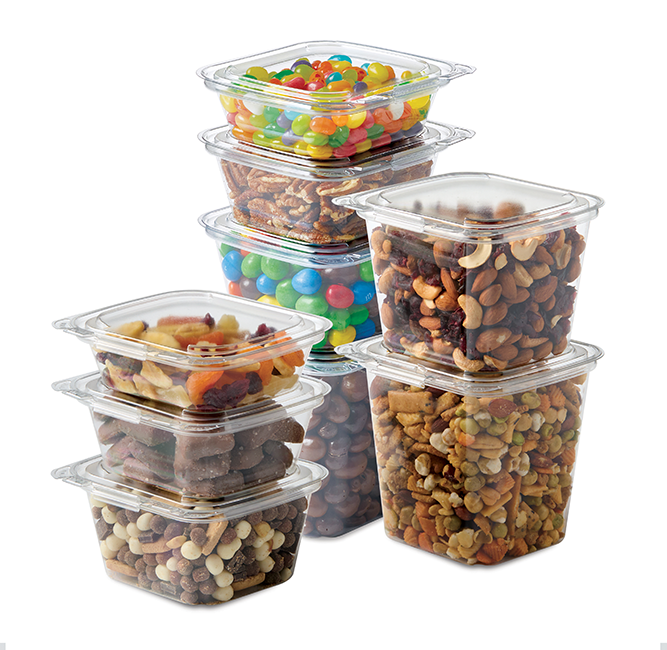 Clear containers filled with assorted candy, dried fruit, nuts, and snack mixes