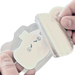 Hand opening a small beige plastic case with a compact device inside