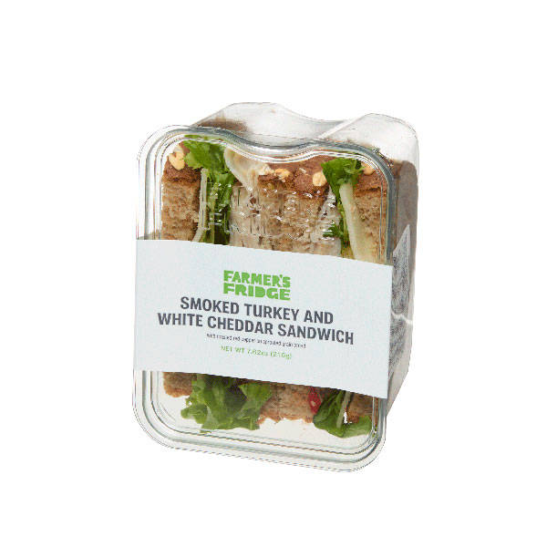 Packaged Farmer’s Fridge smoked turkey and white cheddar sandwich in a clear container